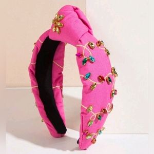 Pink knotted headband embroidered with stones with Christmas lights motif